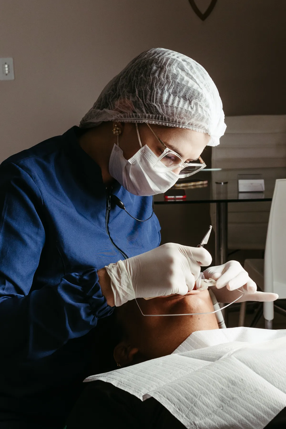 Dental professional examining a patient
