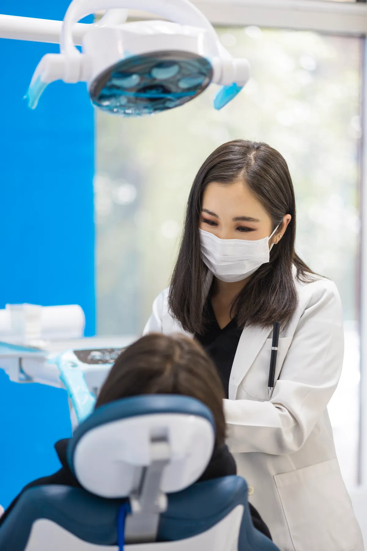 Dentist preparing to examine a patient in a clinic