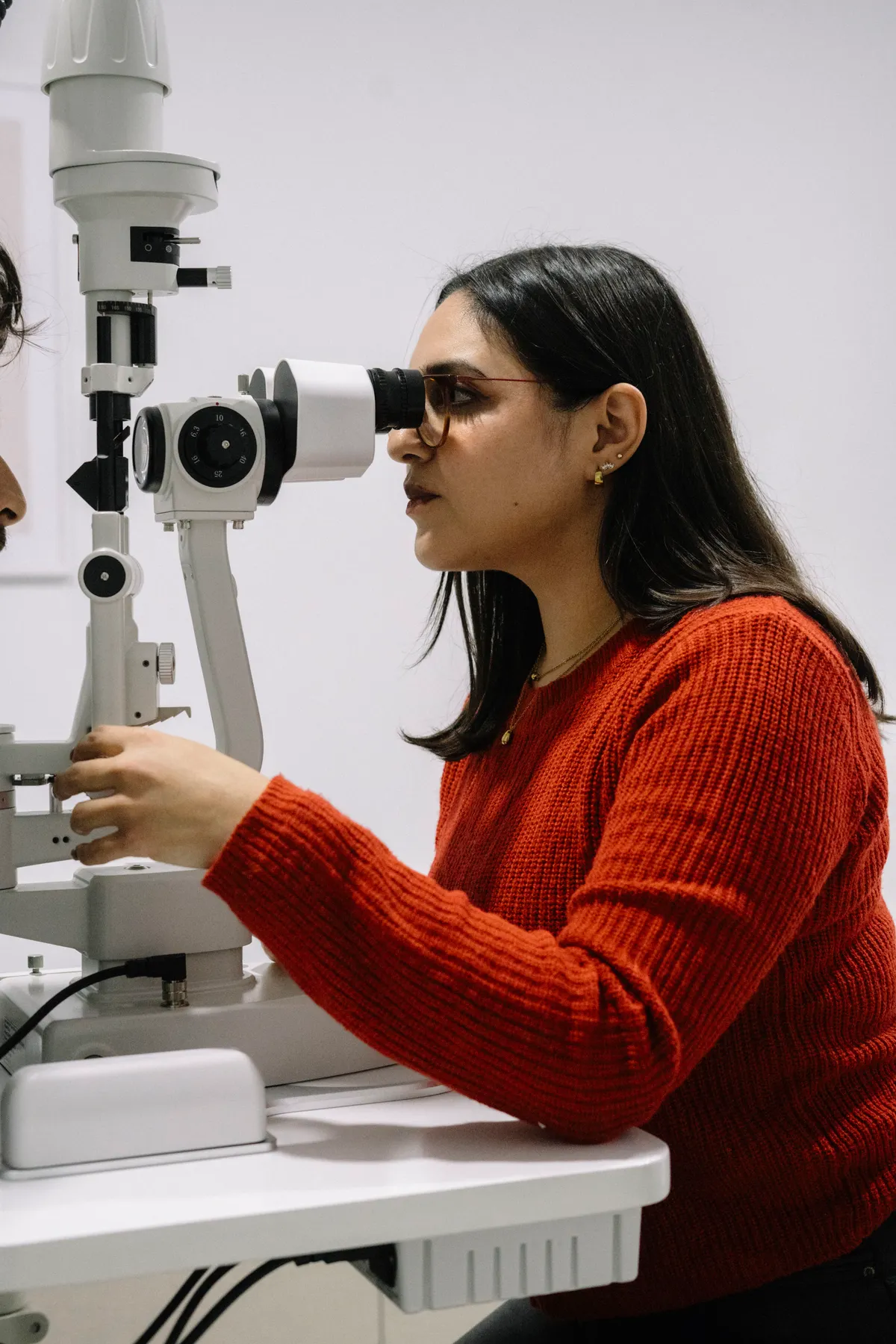 Woman receiving an eye examination with a slit lamp