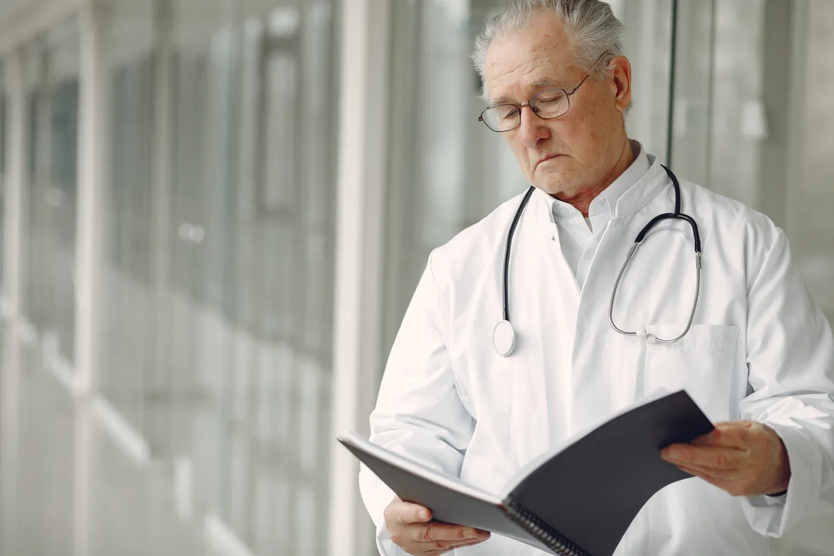 Doctor reviewing a file in a clinic