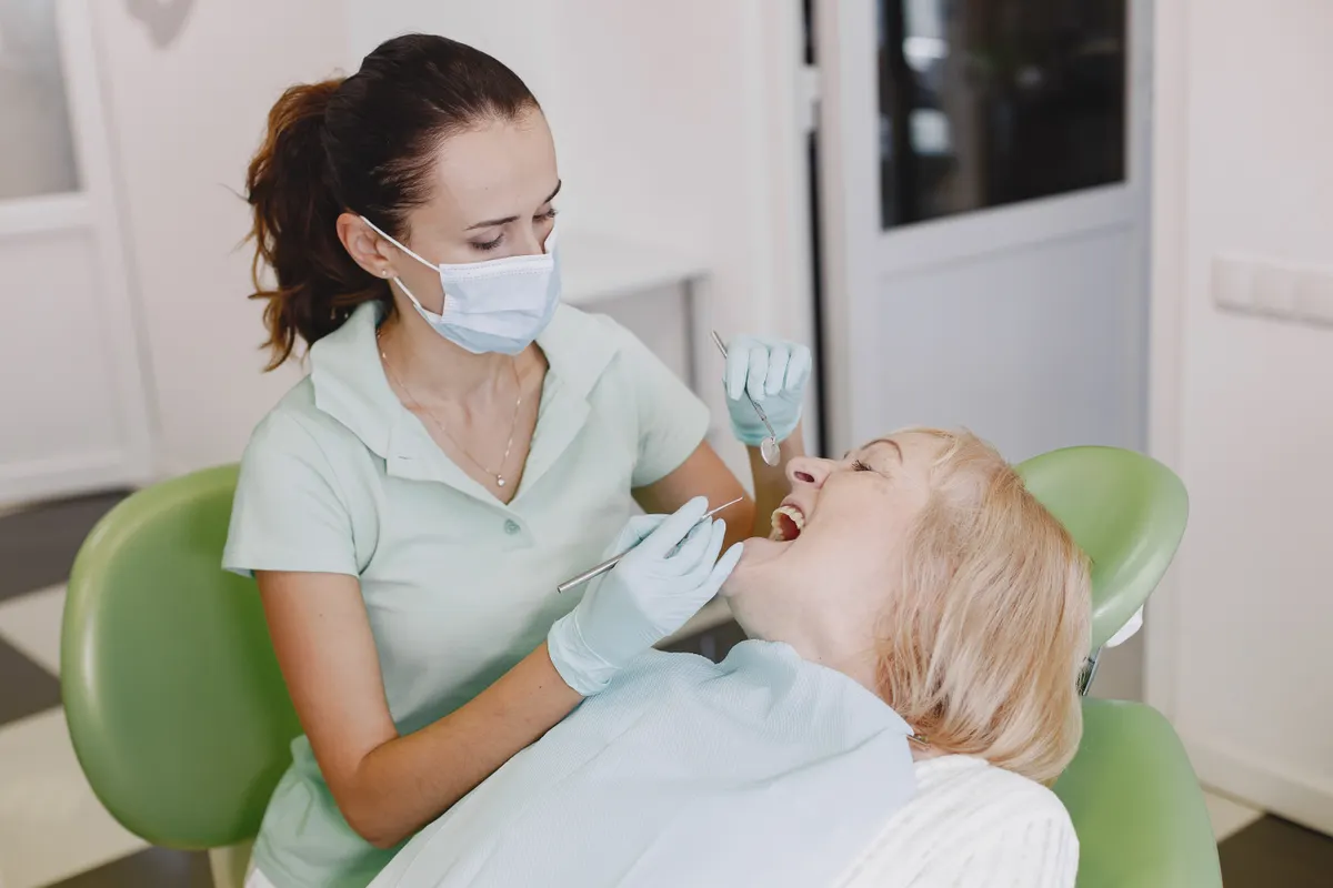 Dentist performing an examination in a bright clinic