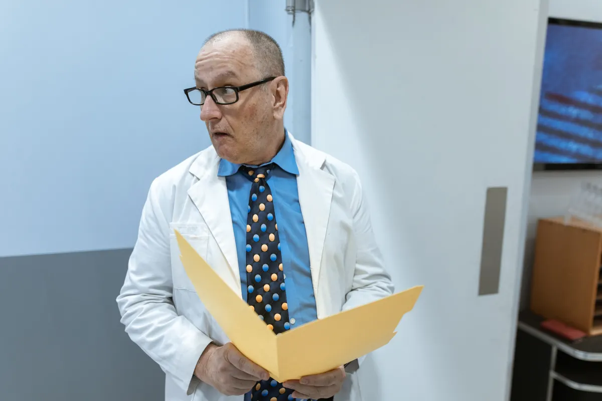 Doctor reading a patient file