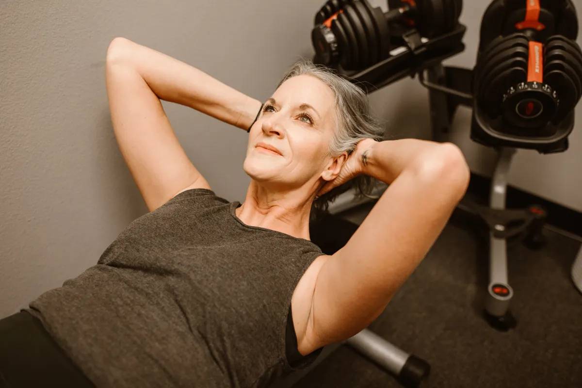 Older woman exercising in a gym