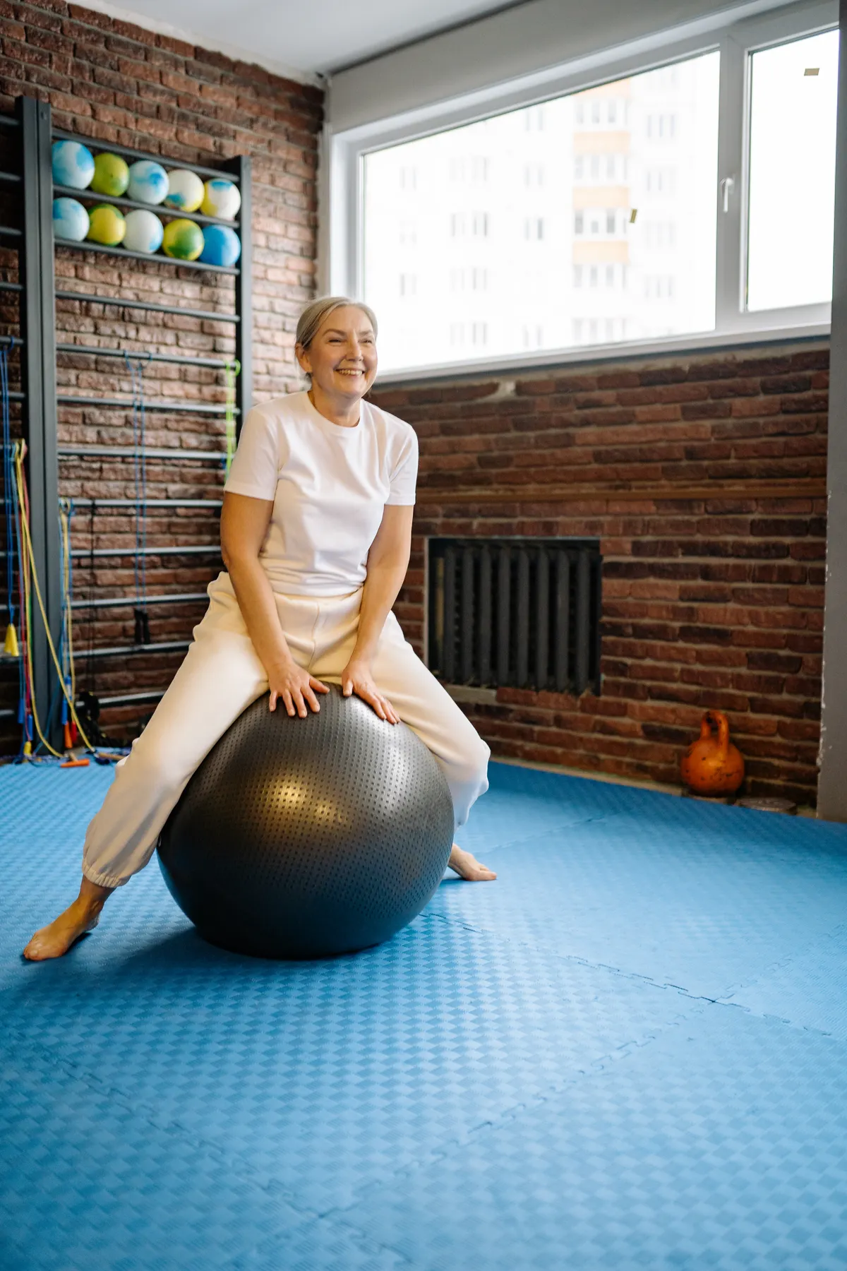 Older woman sitting on a stability ball