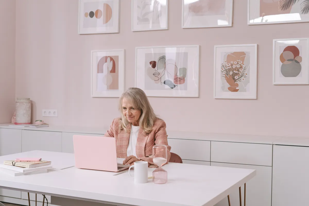 Woman using a laptop in a bright office