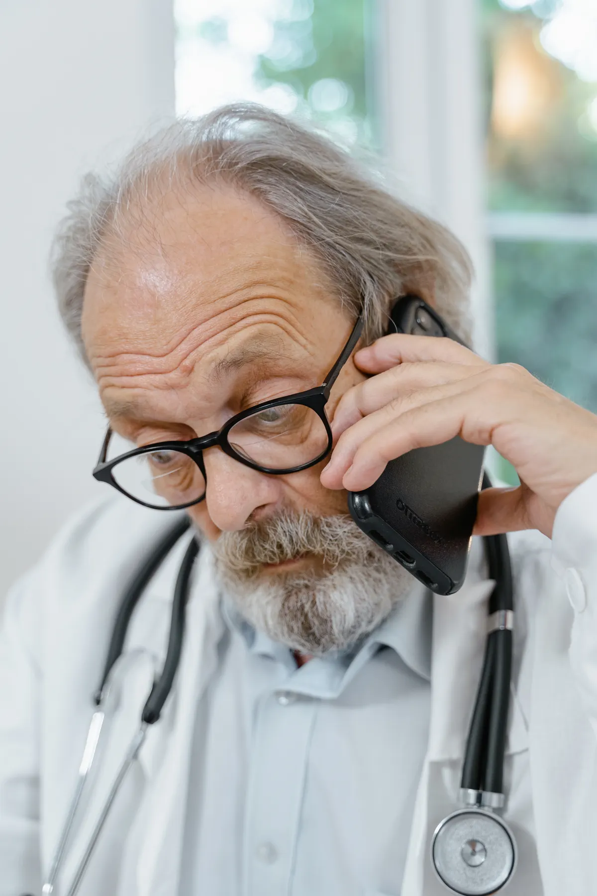 Doctor speaking on a telephone