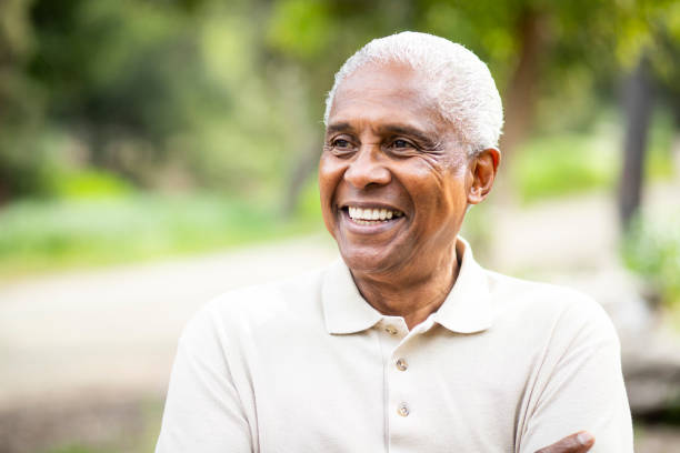 "Smiling senior man outdoors, representing individuals exploring financial assistance options for Simponi Aria treatment costs."

