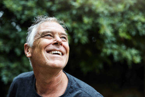 Happy elderly man outdoors, smiling with a sense of security, symbolizing the benefits of comprehensive Medicare Supplement coverage